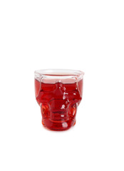 Wine glass in shape of a skull with red wine on white background