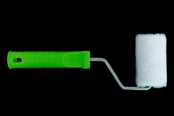 Painting roller on black background. Preparation for repair