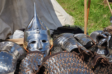 Armor of participants in the competition for the Medieval Battle. Тhеrе are a helmet, plate armor, bracers  and metal mittens © arostynov