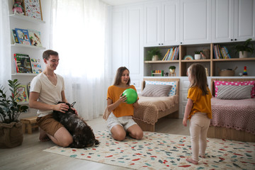 Caucasian family playing with balls at home