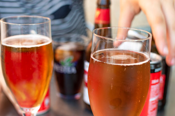 Take something among friends. Different types of drink on the table.