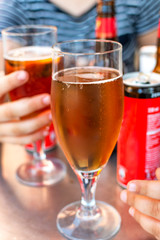 Take something among friends. Different types of drink on the table.