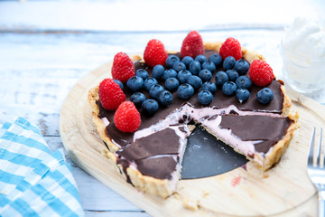 Homemade Chocolate cake with fresh blueberries  raspberries