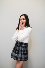 Asian girl with nice outfit, short skirt and long sleeve shirt