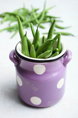 String beans in purple pot