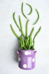 String beans in purple pot