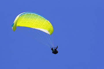 Paragliding in the blue sky as background extreme sport
