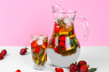 beautiful mojito jar with strawberries and mint on a light background. Close up