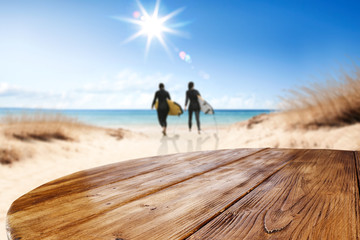 Desk of free space and summer beach background 