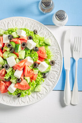 Diet Greek salad with lettuce, tomatoes and onion