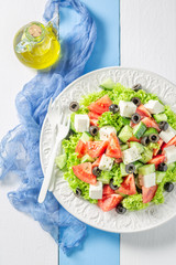 Diet Greek salad with olives, feta cheese and lettuce