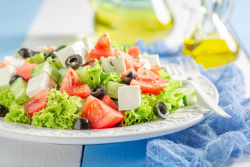 Healthy Greek salad with olives, feta cheese and lettuce