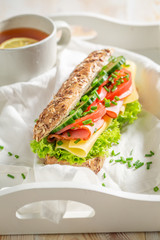 Fresh sandwich with ham, lettue and chive for breakfast