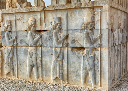 Bas-relief of Persian warriors in Persepolis, Iran was the ceremonial capital of the Achaemenids. The ancient city of the Persians.