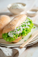Tasty sandwich with crunchy bread, chive and fromage cheese