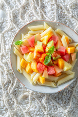 Sweet penne with papaya, melon and pineapple