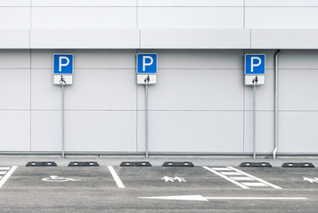 Empty car parking lot at a supermarket with family and disability parking places, public parking...