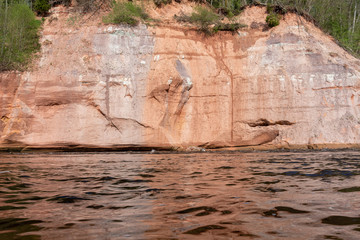 Red sandstone cliff at Gauja river, Latvia.