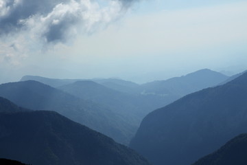 Fototapeta na wymiar Clouds in high Alpine mountains