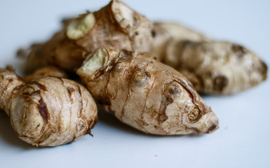 Ginger or Zingiber officinale on white background. Used as a spice and a folk medicine.