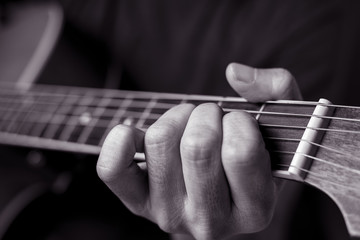 Musicians are playing acoustic guitar.