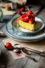 Slice of homemade delicious strawberry tart or pie with sweet glazed berries on top
