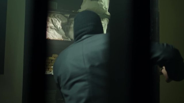 Man in mask robbing a bank