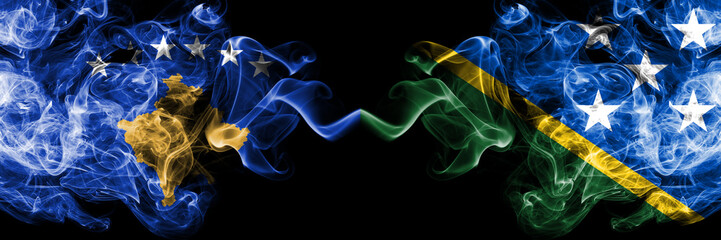 Kosovo vs Solomon Islands smoky mystic flags placed side by side. Thick colored silky smokes...
