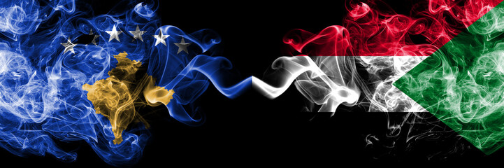 Kosovo vs Sudan, Sudanese smoky mystic flags placed side by side. Thick colored silky smokes combination of Kosovo and Sudan, Sudanese flag