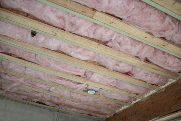 work in progress at a home ceiling with insulation ready for wall boarding