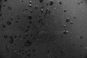 texture background water drops on a black background