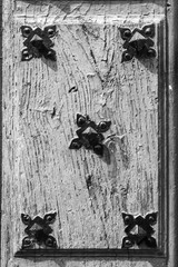 Antique wooden door detail with cracked paint. Grunge background