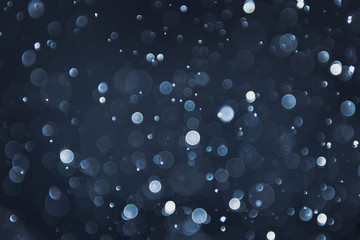 abstract sparkle bokeh light effect with navy blue background