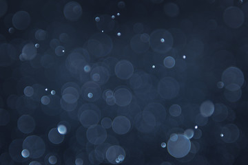 abstract sparkle bokeh light effect with navy blue background