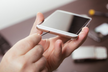 mobile phone repair, hands closeup