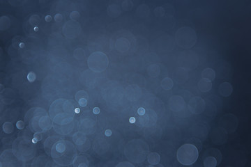 abstract sparkle bokeh light effect with navy blue background