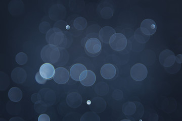 abstract sparkle bokeh light effect with navy blue background