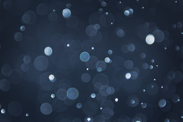 abstract sparkle bokeh light effect with navy blue background