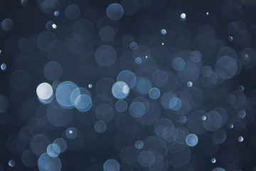 abstract sparkle bokeh light effect with navy blue background