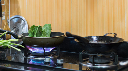 Green vegetables cooked in a hot pan