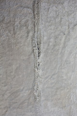 The texture of the white colored torn towel often used as fabric texture background.