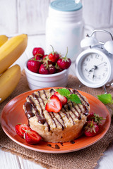 Fresh homemade cake in the microwave with fresh strawberries