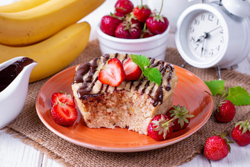 Fresh homemade cake in the microwave with fresh strawberries