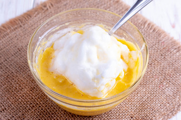 Whipped whites and dough. Cooking sweet pastries