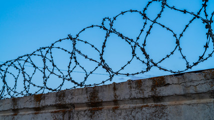 barbed wire on the fence for security