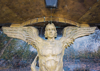 the statue of an angel made of bronze