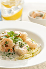 Shrimps in a creamy sauce with pasta