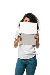 curly african american girl covering face with laptop isolated on white