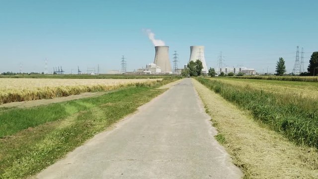 POV driving to Doel Nuclear Power Station with smoking cooling towers