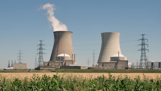 Doel Nuclear Power Station with two smoking cooling towers